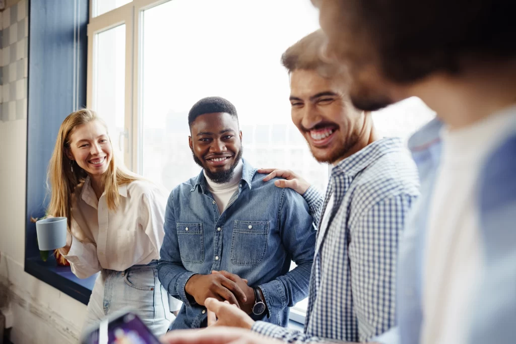 Employees laughing at work